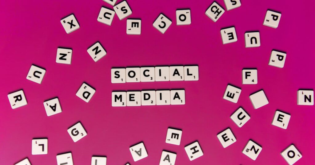 Alphabet tiles forming 'Social Media' on a vibrant pink background, perfect for digital marketing themes.